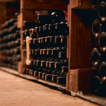 Wine bottles with corks stored in wine cellar